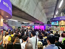 A crowded BTS Station during the rush hour in Bangkok, Thailand Crowded BTS Asok Station.jpg