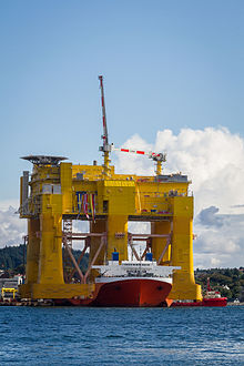 An offshore structure for housing an HVDC converter station for offshore wind parks is being moved by a heavy-lift ship in Norway. Dolwin Beta (14823021740).jpg