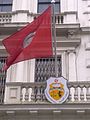 The Tunisian flag and coat of arms above the entrance