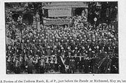 Image of the Richmond Knights of Pythias in front of the Mechanics Savings Bank taken by Farley on May 20, 1902.