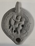 Vaginal sex and anal sex between a female and two males.[22] The figures are all standing.[22] Terra-cotta. Oil lamp. 1st century CE.