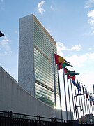 United Nations headquarters building, with flags in foreground