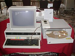 A computer terminal set up with a laserdisc containing information from the 1986 BBC Domesday Project. The original Domesday Book is 900 years old and still legible, while the laserdisc is already considered obsolete and difficult to read. VCF 2010 Domesday tray open.jpg