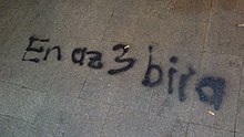 Graffiti showing the words "At least 3 beers", which parodies the government's regulation of sale of alcohol between 22:00 to 06:00 and Erdogan's advice of 3 children Istiklal31may2.jpg
