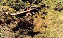 An HH-53C lowering a PJ during a rescue mission, June 1970 HH-53C lowers pararescueman June 1970.jpg