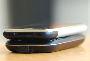 An Apple iPhone in comparison to a HTC S620