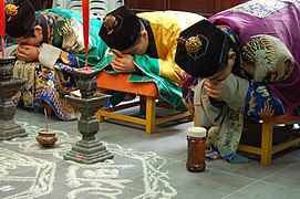 Taoist priests of the Zhengyi order bowing during a rite at the White Cloud Temple of Shanghai. Taoism is a set of orders of philosophy and rite that operate as frameworks of Chinese religion, alongside vernacular ritual traditions.[citation needed]