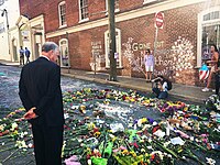 Senator Tim Kaine at impromptu memorial to Heather Heyer Tim Kaine inspects a makeshift memorial to Heather Heyer.jpg