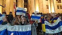 Russians protest against the war in Ukraine with the white-blue-white Russian flag, on 2 March 2022 White-blue-white flag in Tbilisi.jpg