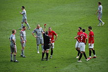 Liverpool players (in grey) during the 4-1 win against Manchester United at Old Trafford on 14 March 2009. 2009-3-14 ManUtd vs LFC Red Card Vidic.JPG