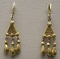 Pair of matching earrings with triple pendants