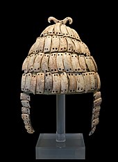 Boar's tusk helmet with cheek-guards and a double bone hook on top. Mycenae, chamber Tomb 515, 14th - 13th centuries BC. Ndeg6568 Boars's tusk helmet NAMA6568 Athens Greece1.jpg