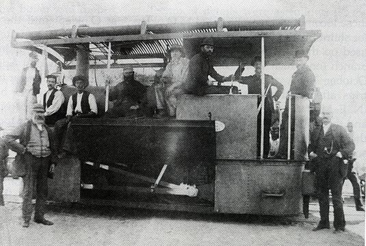 Possibly John Taylor, with cab roof installed and motion exposed, c. 1886
