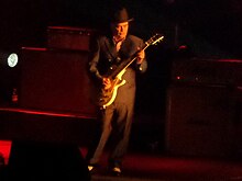 Foreman performing live with Madness at Manchester Arena, in 2014