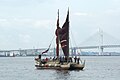 Hōkūle‘a arrives in Yokohama Bay, 2007; Yokohama Bay Bridge in background