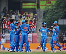 Indian players celebrating after taking a wicket against New Zealand in 2010 India Vs New zealand One day International, 10 December 2010 (6159883395).jpg