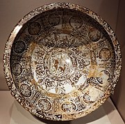 Lustreware great basin signed by Abu Zayd al-Kashani in 1191, Kashan, Iran.[6]