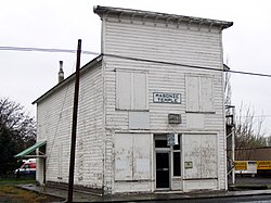Photograph of the Umatilla Masonic Lodge Hall, a white, two-story, wooden, false front building