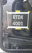 A temporary window sign with RTDX markings RTDX 4001 reporting mark sign seen from RTDX 4004 cab.jpg