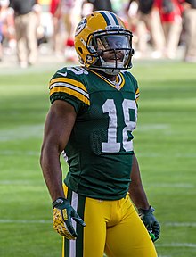 Cobb standing in uniform on a field