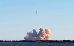 A picture of flying rocket, with large plume at the ground