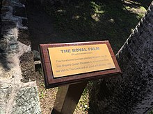 A plaque commemorating the planting of a palm tree by the Queen in 1966 at Nelson's Dockyard, Antigua The Royal Palm at Nelson's Dockyard.jpg