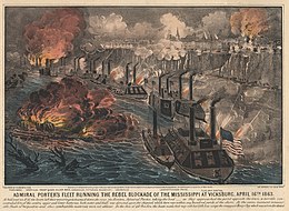 A line of about a dozen Union gunboats on the Mississippi River exchange fire with the town above on a cliff