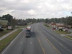 The 5000 block of the six-lane Augusta Road with George A. Mercer Middle School and Universal Steel Supply on the left and a local Dairy Queen restaurant on the right.