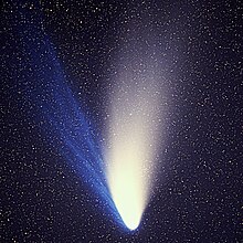 The sparse plasma (blue) and dust (white) in the tail of comet Hale-Bopp are being shaped by pressure from solar radiation and the solar wind, respectively. Comet Hale-Bopp 1995O1.jpg