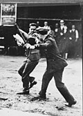 A police officer confronts a striking longshoreman, San Francisco 1934