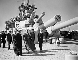 Emir Mansur of Saudi Arabia visiting HMS Queen Elizabeth at Alexandria WWII IWM A 9618.jpg