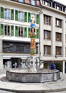 Fountain de la Justice which features the attributes of jurisprudence and justice. Switzerland. Fontaine de la Justice Palud Lausanne.jpg