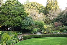 circular hedges and lawn leading to an accessible garden