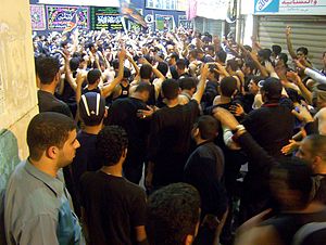 Shi'a Muslims in Bahrain strike their chests d...