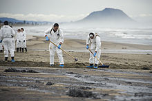 Oil spill emergency response, governed by environmental cleanup law Rena oil spill cleanup.jpg