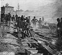William Tecumseh Sherman's troops destroying a railroad near Atlanta Sherman railroad destroy noborder crop.jpg