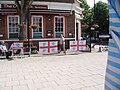 The Old Bank pub is situated on the corner of the square and Southwark Park Road. The flags represent support for England and Millwall Football Club whose ground The Den is close to The Blue.
