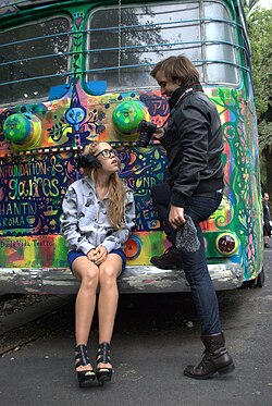 Model and photographer in front of a trolleybus in Colonia Hipodromo painted by Fumiko Nakashima. The Roma-Condesa neighborhoods of Mexico City are known for their hipster subculture.[1]