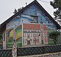Hausfassaden-Bilderuhr-Mosaik in Wien, 22. Bezirk