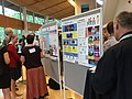 Shooting Isla in front of our posters at the poster session