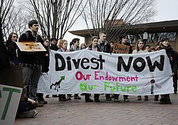 Students at Tufts University in 2013 "marched forth on 4 March". The march was a divestment campaign with the goal of pressuring universities to eliminate investments in fossil-fuel related ventures. Fossil Fuel Divestment Student Protest at Tufts University.jpg