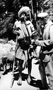 Gaddi village men with hookah, on mountain path, 1980.jpg