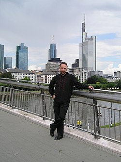 Jimmy Wales on the Holbeinsteg bridge in Frankfurt am Main, Germany, during a shooting break of a documentary film on Wikipedia created by French-German TV station arte.