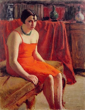 Donna in rosso seduta