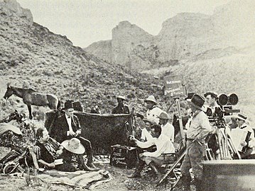 Publicity still of cast and crew on location