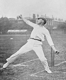 A cricketer bowling, seen from the side