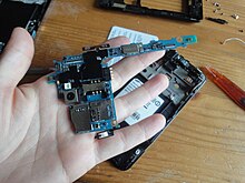 The motherboard of a Samsung Galaxy SII; almost all functions of the device are integrated into a very small board. Samsung galaxy s2 internal2.JPG