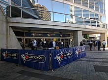 Exterior entrance to one of two Jays Shop locations at Rogers Centre Toronto Blue Jays Shop, Rogers Centre -throughglass (35678680363).jpg