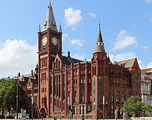 The centrepiece of the university estate, the Victoria Building, opened in 1892 as the first purpose built facility for the university. The building was the inspiration for the term "red brick university" which was coined by Professor Edgar Allison Peers. Victoria Building, University of Liverpool 2019.jpg