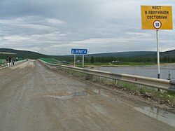 Bridge over the Amga River with the village in the background